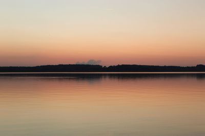 Scenic view of lake against romantic sky at sunset