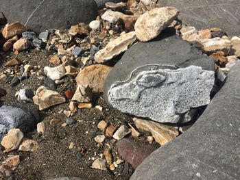 High angle view of pebbles at beach