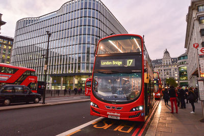 View of cars in city against sky