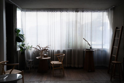 Stylish living room with corner windows with blinds