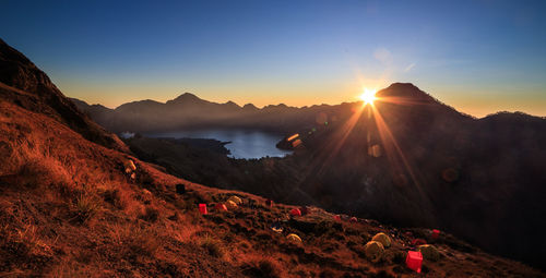 Scenic view of mountains against sky during sunset