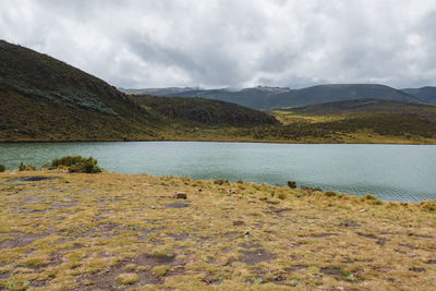Scenic view of lake ellis against mountains at chogoria route, mount kenya national park, kenya