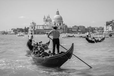 People in front of river