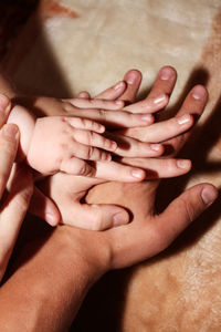 Midsection of couple holding hands