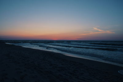 Scenic view of sea against sky at sunset