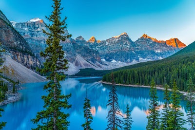 Moraine lake sunrise in summer. snow-covered valley of ten peaks turning red. banff national park