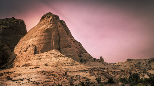 Low angle view of rock formation against sky