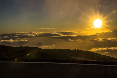 Scenic view of mountains against sky during sunset