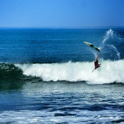 People surfing in sea