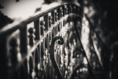 Close-up of bicycle parked by railing