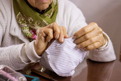 Close-up of woman holding hands