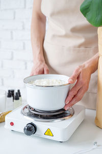 Midsection of man preparing food on table