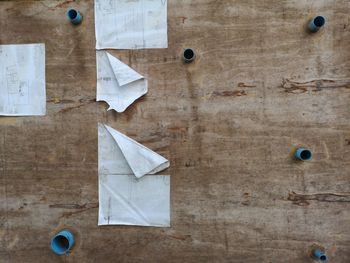 High angle view of papers on wooden table