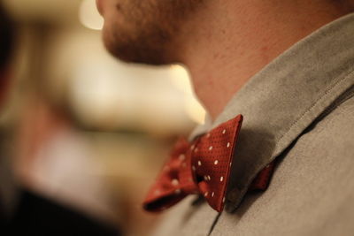 Cropped image of man wearing bow tie during party