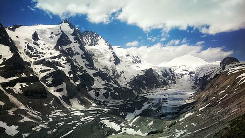 Scenic view of snowcapped mountains against sky