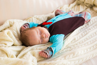 Boy sleeping in bed