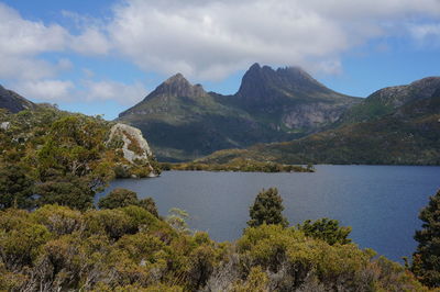 Scenic view of lake and mountains against sky