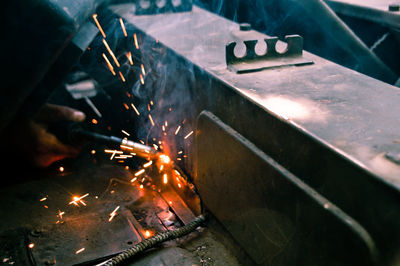 Close-up of hand welding metal