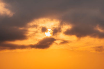 Low angle view of moon against sky during sunset