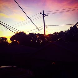 Silhouette of trees against sky at sunset