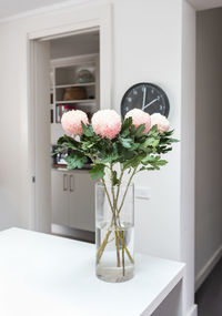 Flower vase on table at home