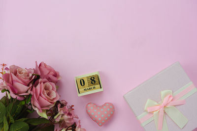 Close-up of heart shape with pink roses in box