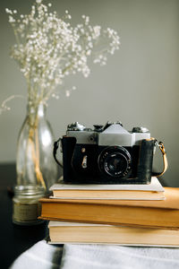 Close-up of camera on table at home