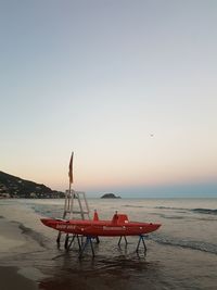 Lifeguard hut on beach against clear sky