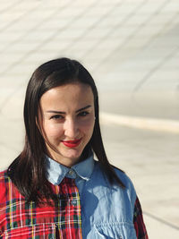 Portrait of young woman looking away