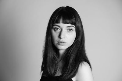 Portrait of a beautiful young woman over white background