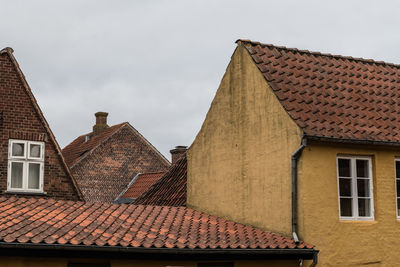 Low angle view of houses against sky