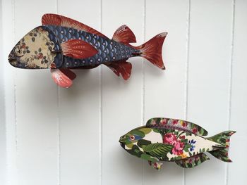 Artificial fish decorations on wall