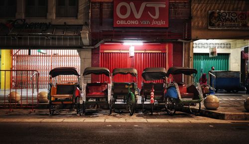 Empty chairs and tables in illuminated restaurant