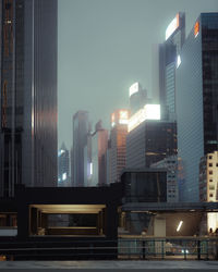 Low angle view of modern buildings in city at night