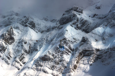 High angle view of snowcapped mountains during winter