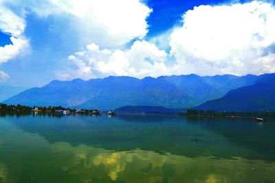 Scenic view of lake against cloudy sky