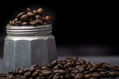 Close-up of coffee beans on table