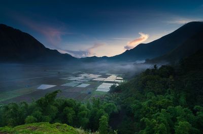 Scenic view of mountains against dramatic sky