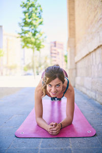 Portrait of a young woman sitting outdoors