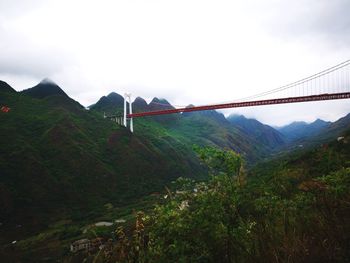 Scenic view of suspension bridge against sky