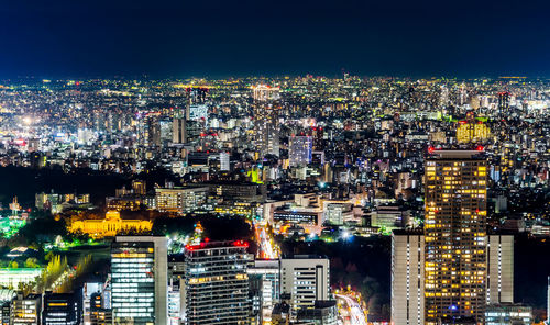 High angle view of illuminated cityscape at night