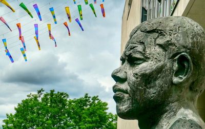 Low angle view of statue against sky