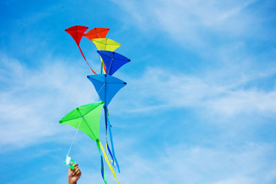 Low angle view of kite against blue sky