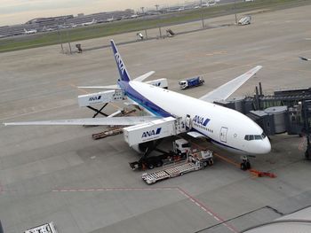 High angle view of airplane on airport runway
