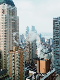 High angle view of buildings in city against sky