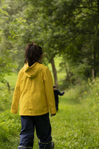 Rear view of man standing on field