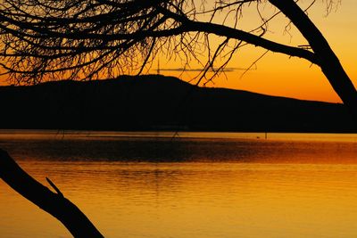 Scenic view of lake against sky during sunset