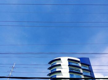 Low angle view of building against blue sky