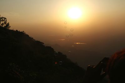 Scenic view of silhouette landscape against sky during sunset