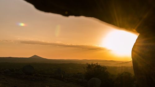 Scenic view of landscape against sky during sunset